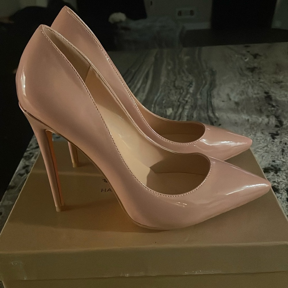 Handmade tan pumps .